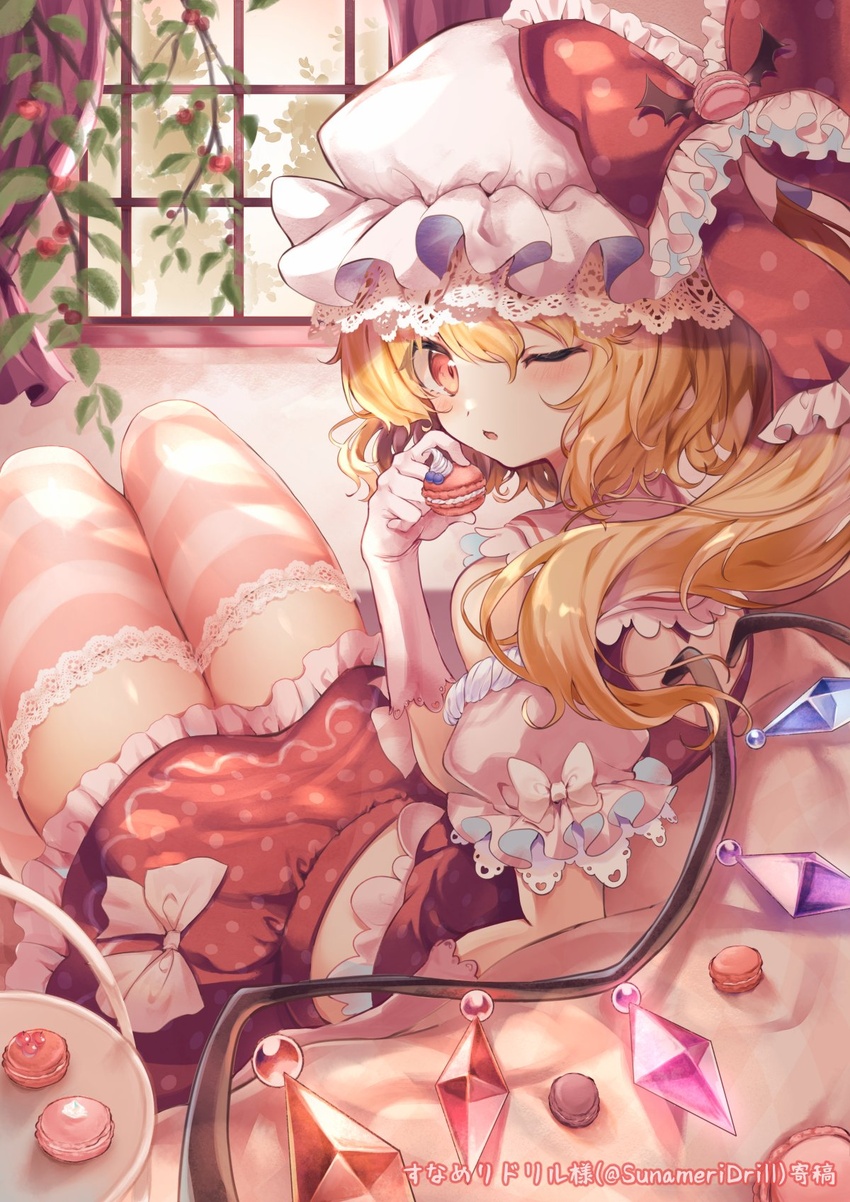 adapted_costume back_cutout blonde_hair clothing_cutout commentary couch crystal female flandre_scarlet food frills hair_between_eyes hand_up hat highres holding holding_food indoors knees_up looking_back macaron midriff mob_cap one_eye_closed one_side_up pink_thighhighs polka_dot red_eyes red_shirt red_skirt sekisei_(superego51) shirt short_hair short_hair_with_long_locks sitting skirt solo thighhighs touhou window wings