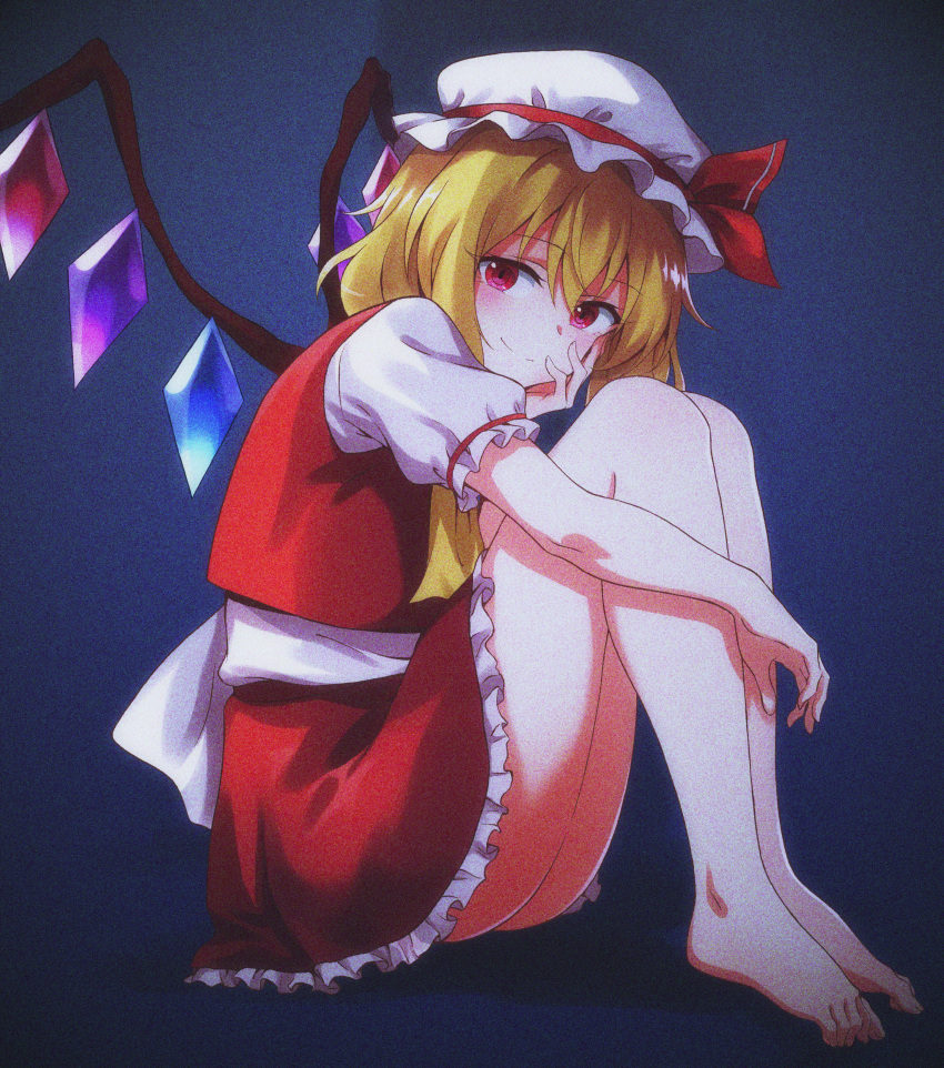 absurdres ascot ass bare_legs barefoot blonde_hair closed_mouth commentary_request crystal dark female flandre_scarlet frilled_skirt frills hand_on_own_cheek hand_on_own_face hat hat_ribbon highres knees_up looking_at_viewer mob_cap momihige red_eyes red_shirt red_skirt ribbon shirt short_hair short_sleeves sitting skirt skirt_set smile solo touhou white_hat wings