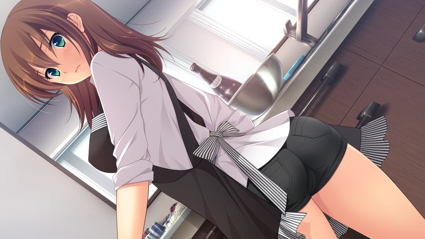 apron black_shorts blush bow breasts brown_hair closed_mouth denim denim_shorts dutch_angle female from_behind game_cg green_eyes hatsukoi_1/1 indoors kitchen koizumi_amane large_breasts long_hair looking_at_viewer looking_back short_shorts shorts solo striped striped_bow tokizaki_maya