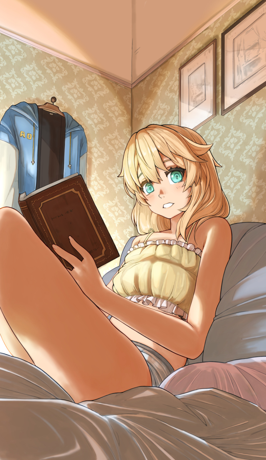 1boy absurdres bare_legs bed blonde_hair book bridget camisole clothes_hanger frilled_camisole frills guilty_gear guilty_gear_strive highres holding holding_book hood hooded_jacket jacket medium_hair open_book open_mouth otoko_no_ko panties picture_frame sitting solo sugajyun thighs underwear unworn_jacket