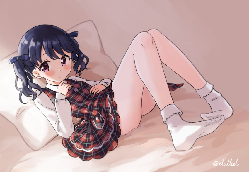 ankle_socks bare_legs black_hair blush bobby_socks commentary_request dress dutch_angle eluthel expressionless feet female fukumaru_koito full_body hair_ribbon hand_on_own_chest hand_on_own_stomach highres idolmaster idolmaster_shiny_colors knees_up long_sleeves looking_at_viewer medium_hair no_bra no_shoes on_bed pillow pinafore_dress plaid plaid_dress purple_eyes reclining ribbon shirt short_dress sleeveless sleeveless_dress socks solo thighs twintails twitter_username wavy_hair white_shirt white_socks