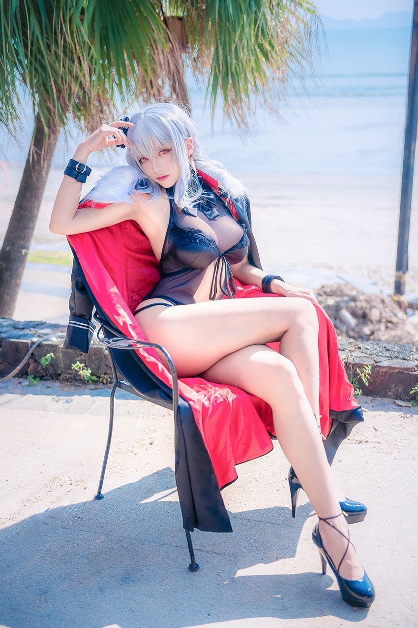 arm_up armpits azur_lane bangs bare_legs black_coat black_swimsuit blue_footwear blurry breasts buckle casual_one-piece_swimsuit chair cleavage closed_mouth coat coat_removed cosplay day depth_of_field expressionless female full_body fur-trimmed_coat fur_trim graf_zeppelin_(azur_lane) graf_zeppelin_(azur_lane)_(cosplay) hair_ornament head_tilt high_heels highres large_breasts legs_crossed long_hair looking_at_viewer ocean on_chair one-piece_swimsuit palm_tree photo pink_eyes pink_lips shadow silver_hair sitting solo sunlight swimsuit tree water wrist_cuffs