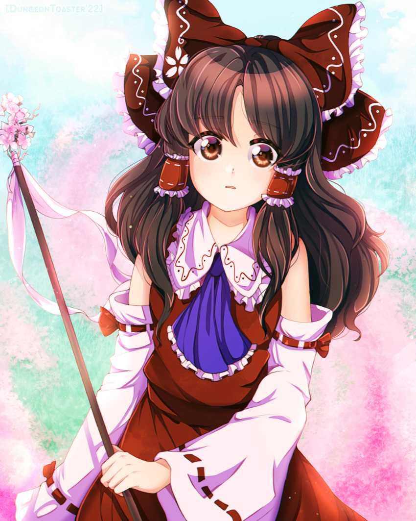 absurdres ascot blue_ascot bow brown_eyes brown_hair cherry_blossoms day detached_sleeves dungeon_toaster female flower gohei hair_tubes hairbow hakurei_reimu highres long_hair looking_at_viewer outdoors pink_flower red_skirt simple_background skirt skirt_set solo touhou