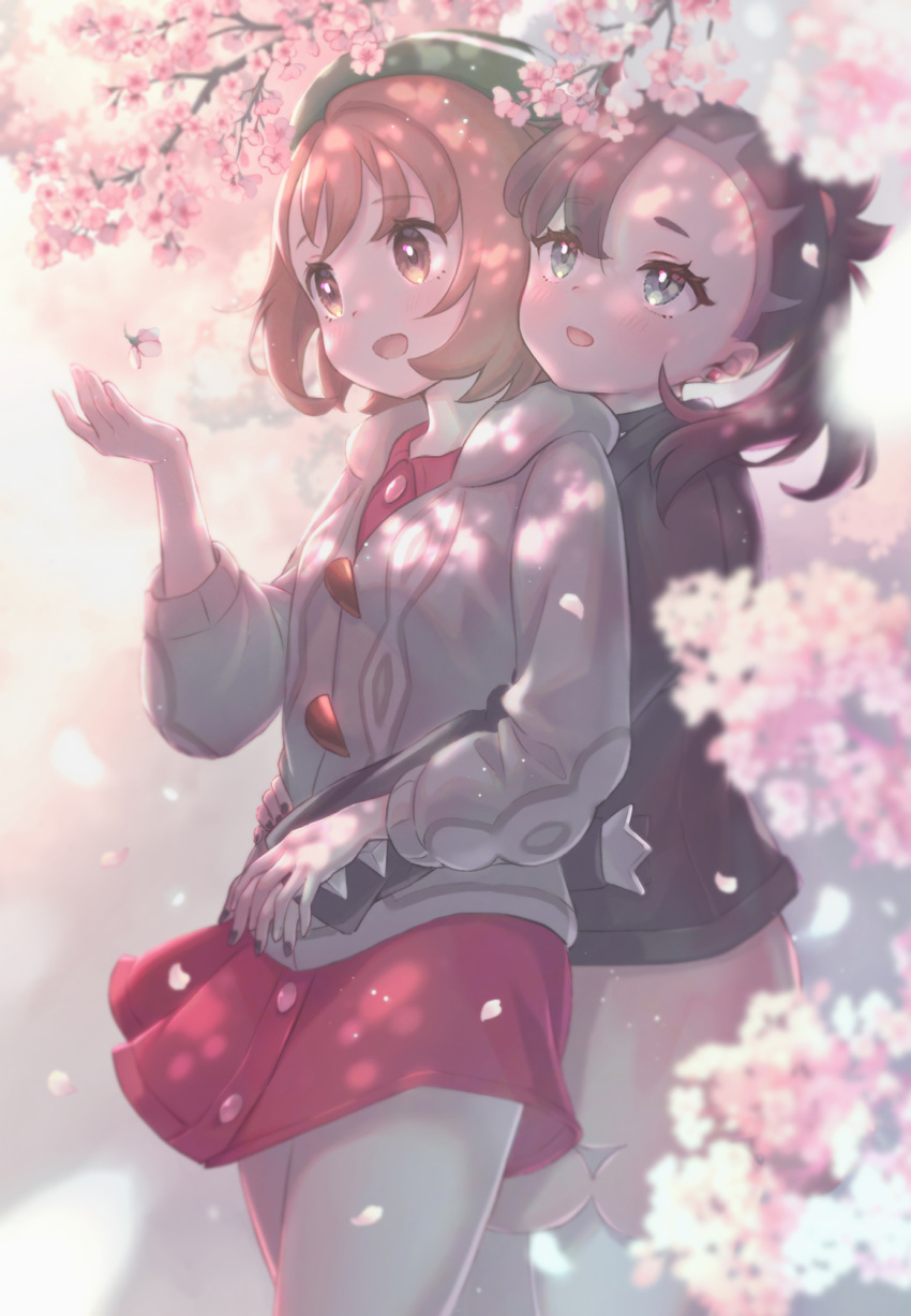 2girls :d asymmetrical_bangs black_hair black_jacket black_nails blurry blush bob_cut brown_eyes brown_hair buttons cardigan cherry_blossoms collared_dress commentary dress earrings eyelashes gloria_(pokemon) green_hat grey_cardigan hair_ribbon hanami hand_up hat highres holding_hands hood hooded_cardigan hug hug_from_behind jacket jewelry looking_up marnie_(pokemon) multiple_girls n2ewu nail_polish open_mouth pink_dress pokemon pokemon_swsh ribbon short_hair smile tam_o'_shanter wind wind_lift yuri