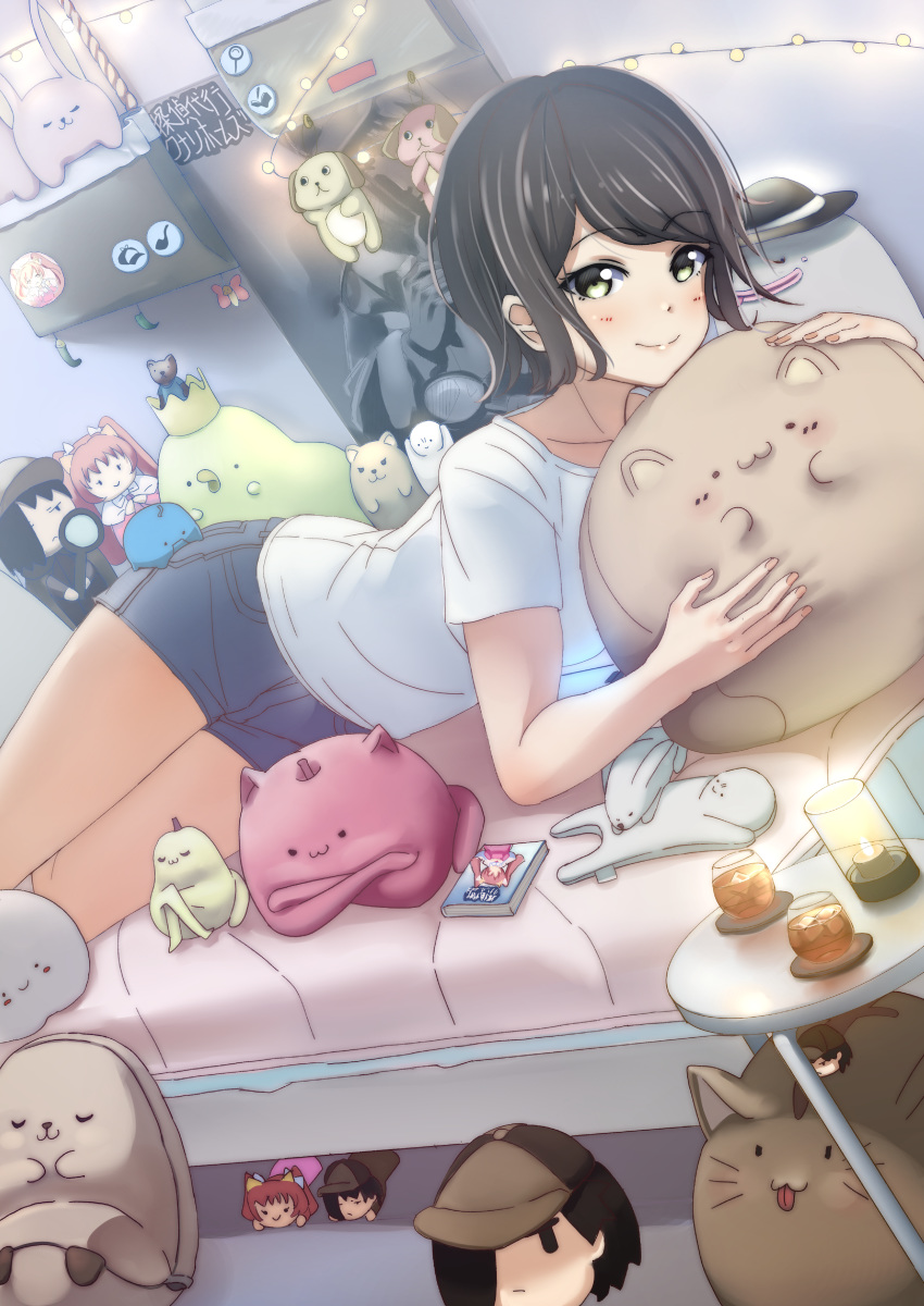 absurdres ajapar badge black_hair blue_shorts button_badge commentary_request denim denim_shorts doll dutch_angle female green_eyes highres indoors looking_at_viewer lying magnifying_glass manga_(object) on_bed on_stomach original shirt shorts smile solo stuffed_animal stuffed_cat stuffed_dog stuffed_toy white_shirt