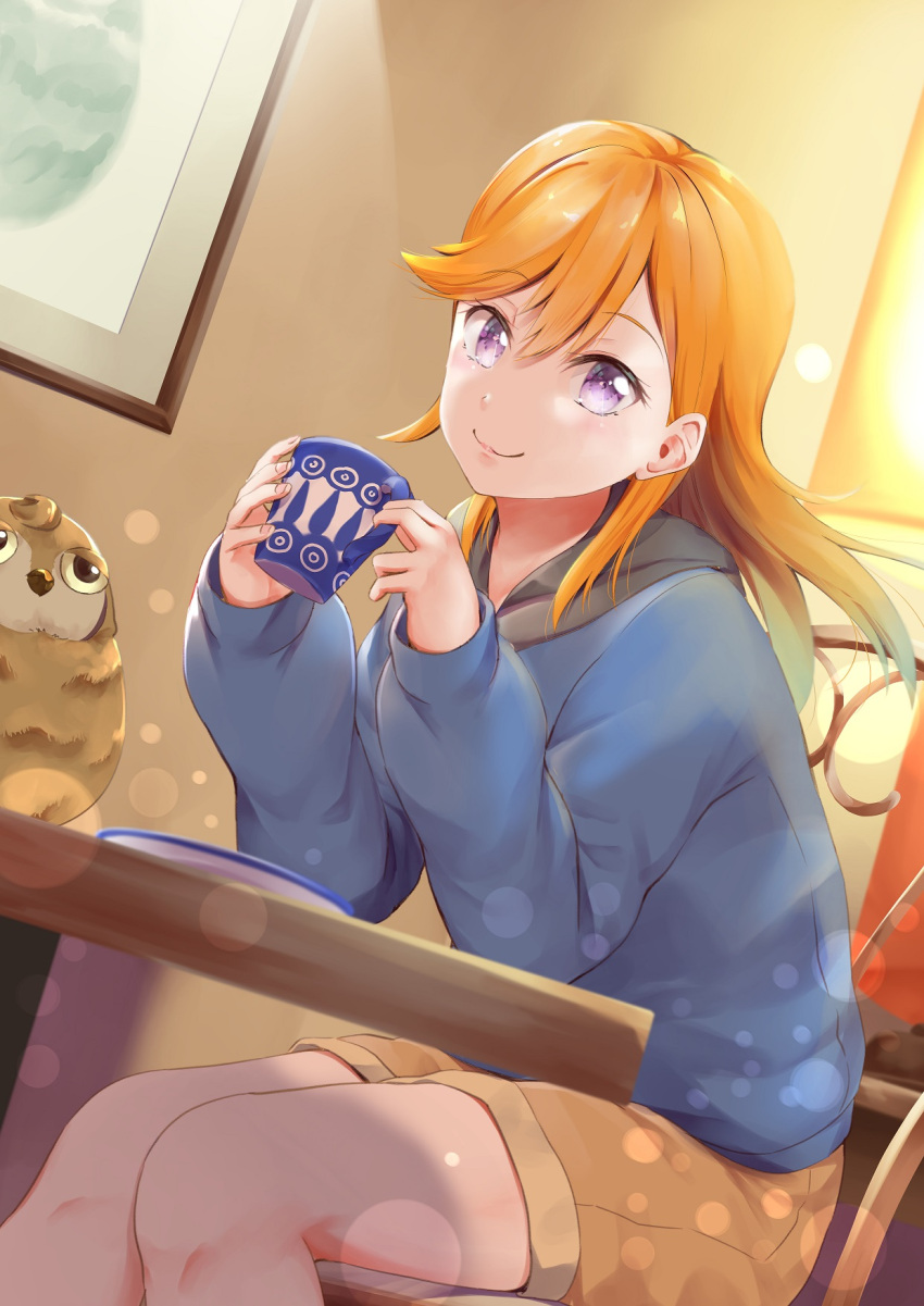 :3 blue_jacket brown_shorts cafe chair coffee_mug cup female hayaoki_(asagi-iro_seishun-bu) highres hood hooded_jacket indoors jacket lamp light_blush light_particles long_hair long_sleeves looking_at_viewer love_live! love_live!_superstar!! mug orange_hair picture_frame purple_eyes restaurant shibuya_kanon shorts sitting smile solo stuffed_animal stuffed_toy table