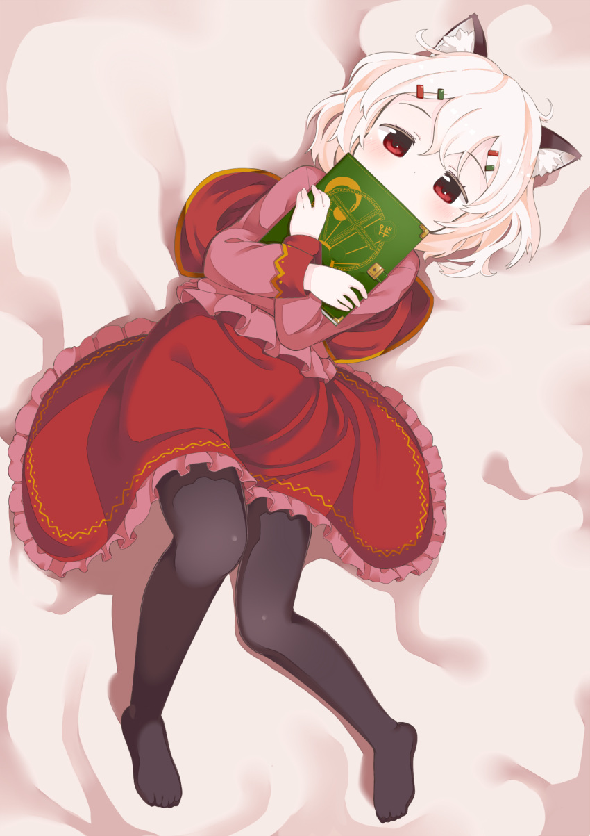 animal_ears blouse book cat_ears commentary_request covering_own_mouth dress female frills grimoire hair_ornament hairclip highres long_sleeves lying magic_circle muku_(muku-coffee) no_shoes on_back original pantyhose red_eyes shiro_(muku) shirt short_hair silver_hair solo