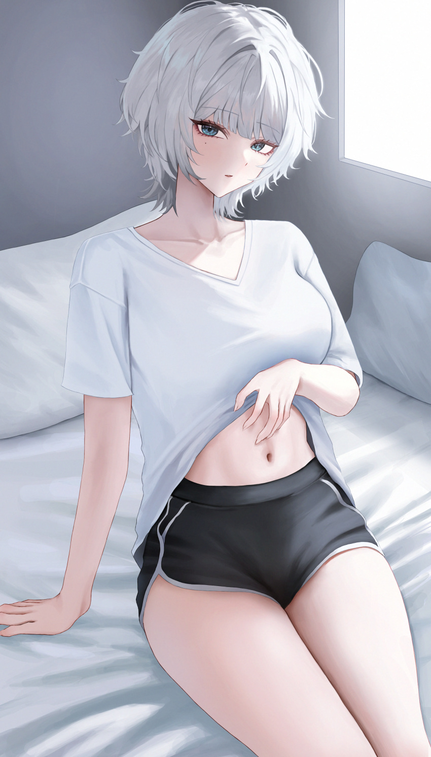 absurdres arm_support bare_legs bed_sheet black_shorts blue_eyes breasts clothes_lift collarbone commentary dolphin_shorts female grey_hair highres indoors large_breasts lifting_own_clothes looking_at_viewer mole mole_under_eye navel original pillow polcoco presenting_stomach shirt shirt_lift short_hair short_shorts short_sleeves shorts sitting solo stomach symbol-only_commentary thighs white_shirt