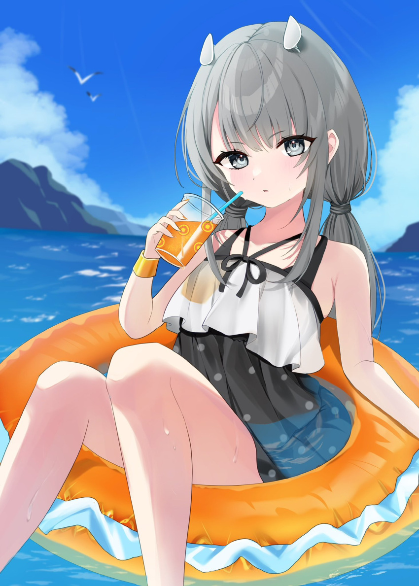 bird blue_sky blush cloud commentary cup day drinking_straw female grey_eyes grey_hair headgear highres holding holding_cup i-201_(kancolle) i-201_(swimsuit_mode)_(kancolle) innertube kantai_collection looking_at_viewer low_twintails one-piece_swimsuit outdoors parted_lips polka_dot polka_dot_swimsuit sidelocks sky solo swim_ring swimsuit symbol-only_commentary twintails water wet yoshino_(mfmfpng)