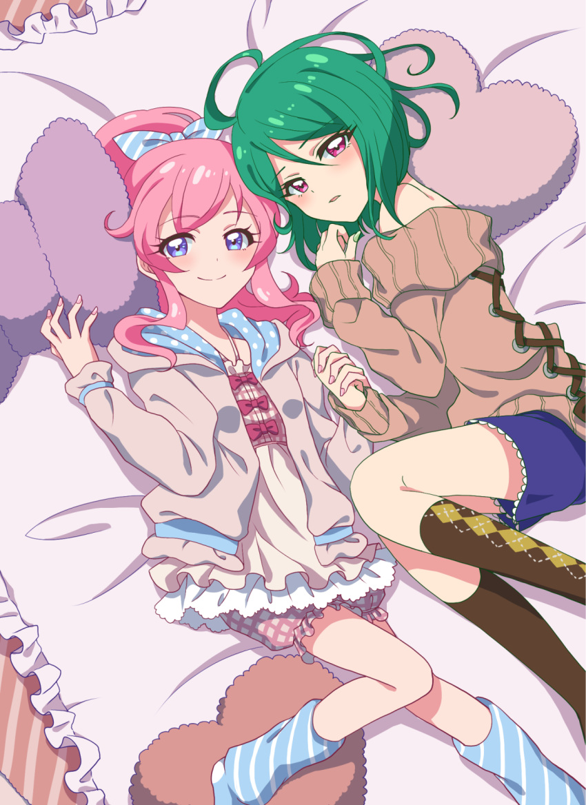 2girls bare_shoulders bloomers blue_eyes blush bow closed_mouth commentary green_hair green_nails highres holding_hands interlocked_fingers kiratto_pri_chan looking_at_viewer lying medium_hair midorikawa_sara momoyama_mirai multiple_girls nail_polish on_back on_bed on_pillow parted_lips pink_eyes pink_hair pink_nails ponytail pretty_series ribbon short_hair smile socks soraeda underwear