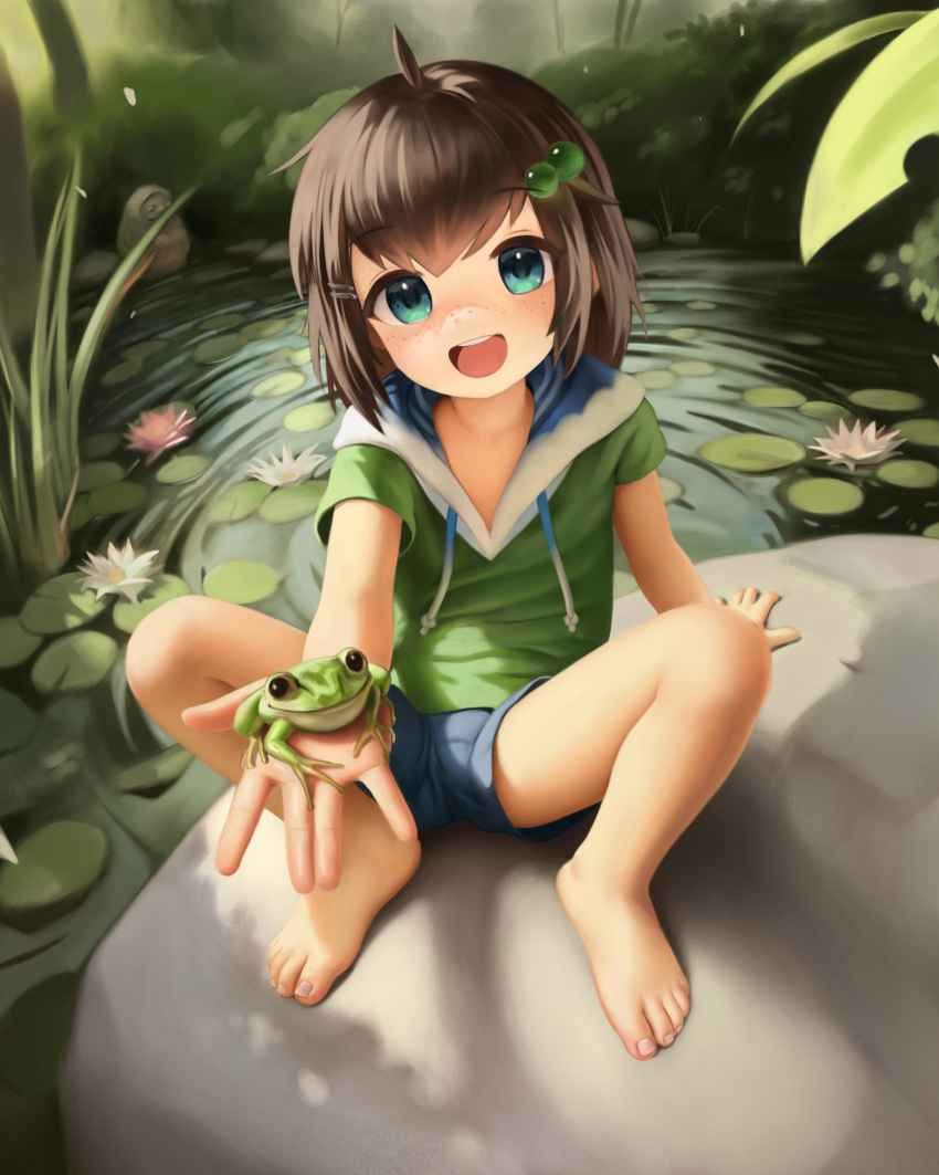 :d absurdres ahoge animal_on_hand bare_legs barefoot brown_hair commentary crumbles drawstring english_commentary feet female freckles frog full_body green_eyes green_hoodie hair_bobbles hair_ornament hairclip highres hood hoodie indie_virtual_youtuber lily_hopkins lily_pad lolicon looking_at_viewer open_mouth outdoors outstretched_hand pond rock short_hair short_sleeves shorts sitting smile solo spread_legs teeth toenails toes upper_teeth_only virtual_youtuber wetland