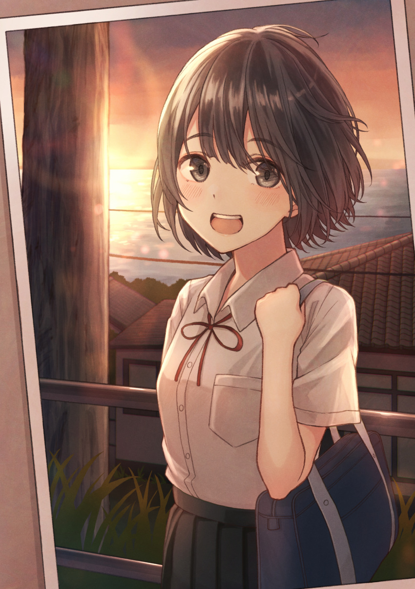 :d adjusting_strap bad_id bad_pixiv_id bag black_skirt bob_cut border bow bowtie breasts brown_background brown_eyes brown_hair commentary cowboy_shot female grass highres holding holding_bag house light_blush looking_at_viewer messy_hair ocean open_mouth orange_sky original outdoors photo_(object) pleated_skirt pocket power_lines railing red_bow red_bowtie red_ribbon ribbon school_bag school_uniform skirt sky small_breasts smile solo sunset tanbonota46 tile_roof utility_pole white_border wind