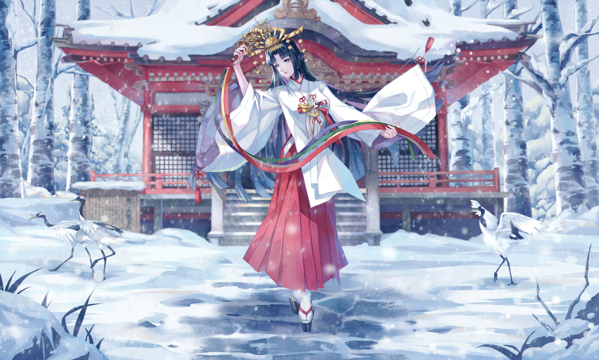 bell bird black_hair commentary commentary_request crane_(animal) crown december female hakama hakama_skirt highres hime_cut holding japanese_clothes jingle_bell kagura_suzu long_hair looking_at_viewer miko original personification red_hakama ryuu32 shrine skirt smile snow solo very_long_hair