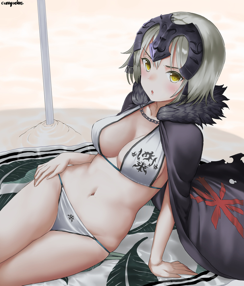 :o arm_support artist_name beach beach_towel bikini blush breasts cape chains cleavage commentary_request curry_soba day fate/grand_order fate_(series) female fur_trim grey_hair headphones highres jeanne_d'arc_alter_(avenger)_(fate) jeanne_d'arc_alter_(fate) looking_at_viewer medium_breasts navel reclining shadow short_hair signature sitting solo swimsuit towel white_bikini yellow_eyes