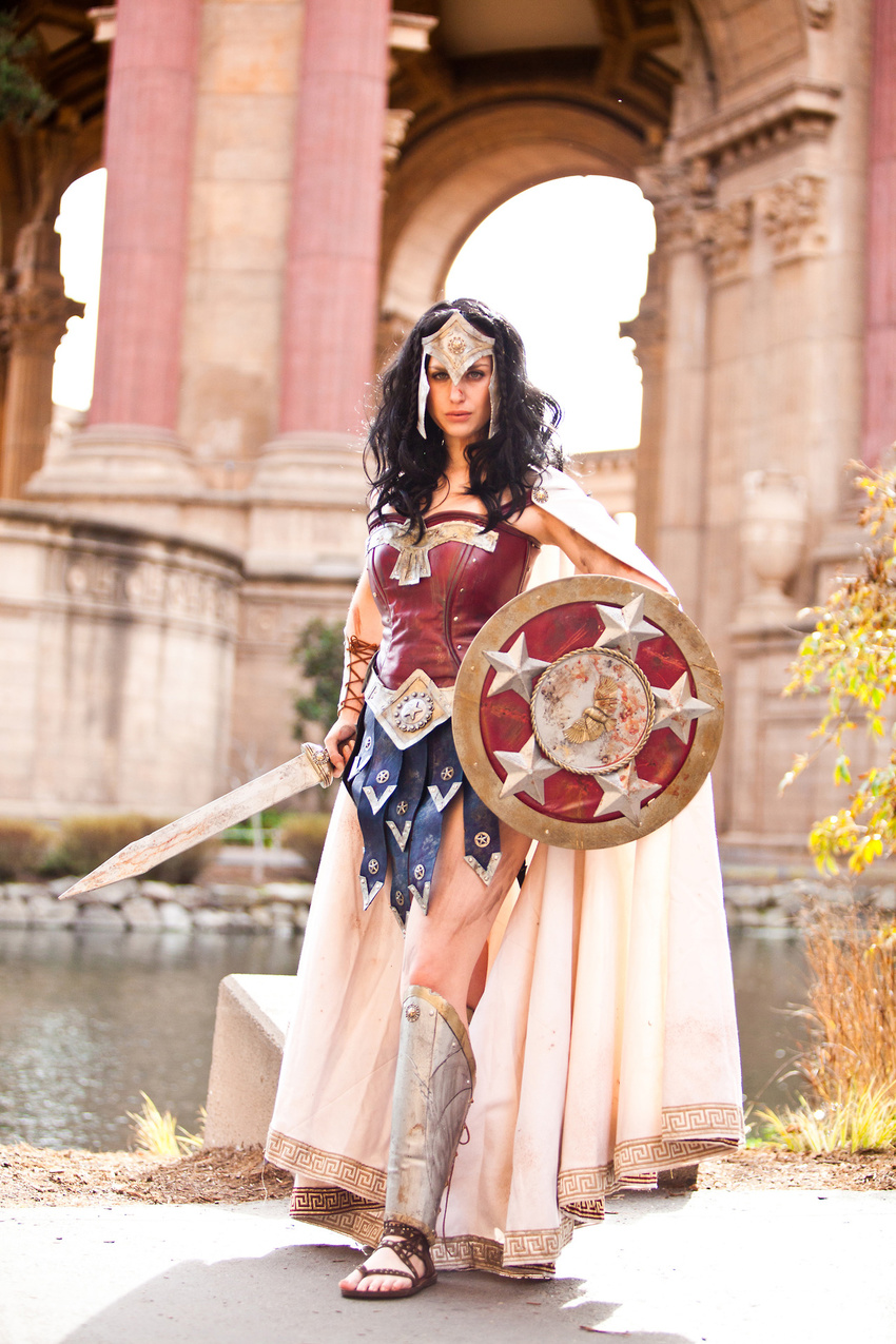 amazon armor black_hair cape cosplay dc_comics female greaves meagan_marie outdoors photo pteruges sandals shield standing sword vambraces water weapon wonder_woman wonder_woman_(cosplay) wonder_woman_(series)