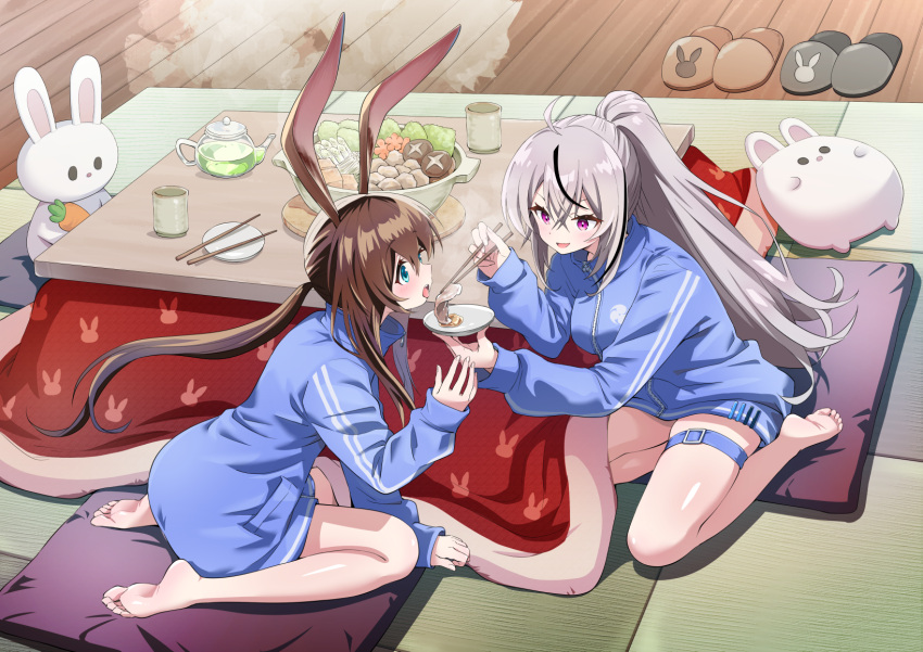 2girls amiya_(arknights) animal_ears arknights bare_legs barefoot black_hair blue_eyes blue_jacket chopsticks cooking_pot feet food grey_hair gym_uniform highres honshiro_nikori jacket kotatsu legs long_hair long_sleeves multiple_girls nabe plate ponytail purple_eyes rabbit_ears rabbit_girl shunsui_rei soles soup table tasting_plate track_jacket track_suit virtual_youtuber zipper