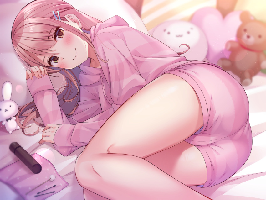 ass bed blush brown_eyes brown_hair cameltoe female hair_ornament hairclip highres hood hoodie indoors long_hair looking_at_viewer lying on_bed on_pillow on_side original pajamas pillow pink_hoodie pink_pajamas pink_shorts rabbit shorts smile stuffed_animal stuffed_toy super_nagoyaka teddy_bear