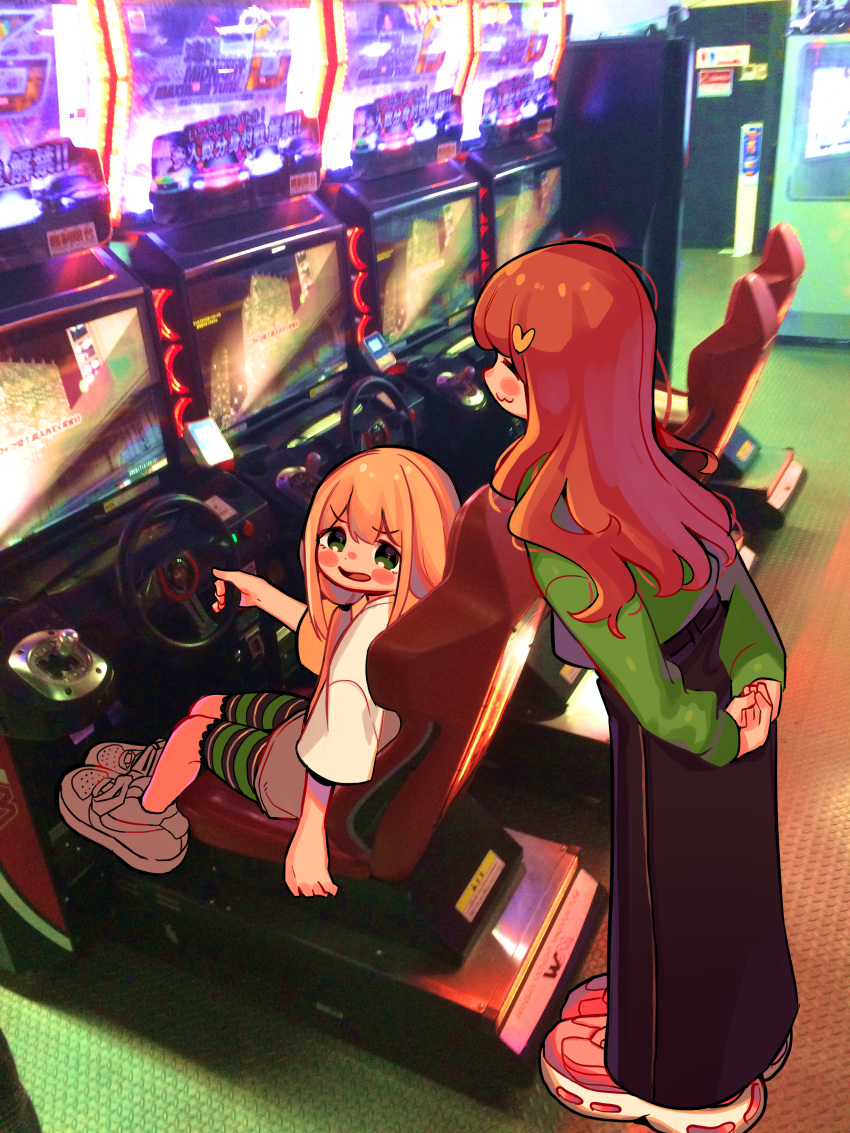 2girls :3 absurdres arcade arcade_cabinet arm_at_side arms_behind_back black_skirt blonde_hair blush_stickers casual closed_eyes commentary_request dot_nose furrowed_brow futaba_anzu green_eyes green_shorts green_sweater hair_ornament heart heart_hair_ornament high-waist_skirt highres idolmaster idolmaster_cinderella_girls indoors leaning_forward long_hair long_skirt long_sleeves looking_at_another low_twintails moai_(more_e_4km) moroboshi_kirari multiple_girls open_mouth orange_hair oversized_clothes photo_background shirt shoes shorts sitting skirt sneakers standing steering_wheel striped_clothes striped_shorts sweater tareme twintails wangan_midnight wavy_hair white_footwear white_shirt