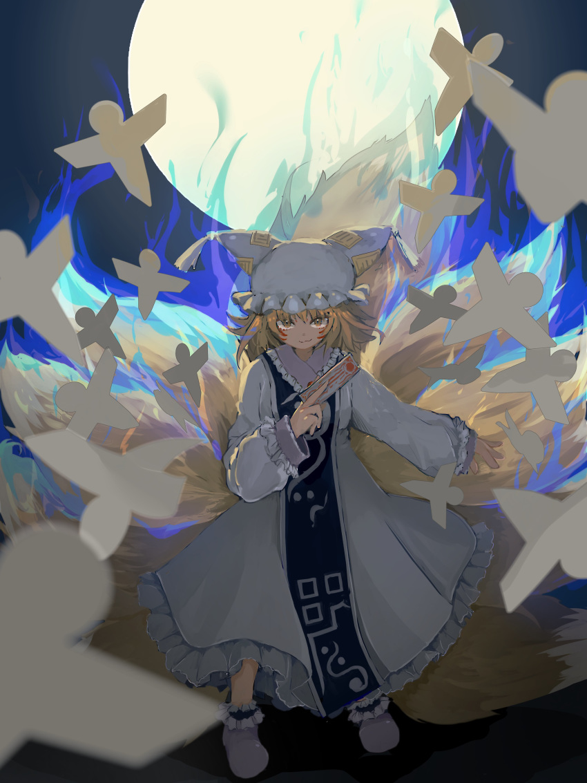 :3 absurdres aged_down animal_ears animal_hat arm_at_side between_fingers blonde_hair blue_fire blurry blurry_foreground closed_mouth commentary dress facial_mark female fire fox_ears fox_tail frilled_dress frilled_legwear frilled_sleeves frills full_moon hand_up hat highres holding ichinose_(kurui96) kitsune light_brown_hair long_dress long_sleeves looking_at_viewer mob_cap moon multiple_tails ofuda ofuda_between_fingers origami outstretched_arm shikigami short_hair sleeve_cuffs smirk smug solo tabard tail tassel touhou whisker_markings white_dress white_footwear yakumo_ran yellow_eyes