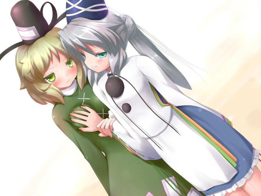 2girls aqua_eyes bad_id bad_pixiv_id blonde_hair breasts brown_hair commentary_request grabbing grabbing_another's_breast green_eyes grey_hair hat highres japanese_clothes kariginu mille mononobe_no_futo multiple_girls ponytail small_breasts soga_no_tojiko tate_eboshi touhou yuri