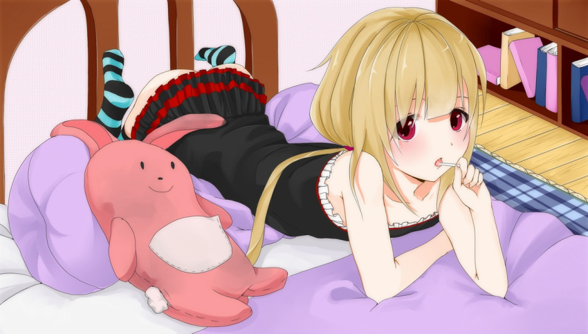 blonde_hair candy commentary_request dress female food futaba_anzu idolmaster idolmaster_cinderella_girls lollipop long_hair lying on_stomach pink_eyes ratsuku_kinoko solo stuffed_animal stuffed_rabbit stuffed_toy thighhighs