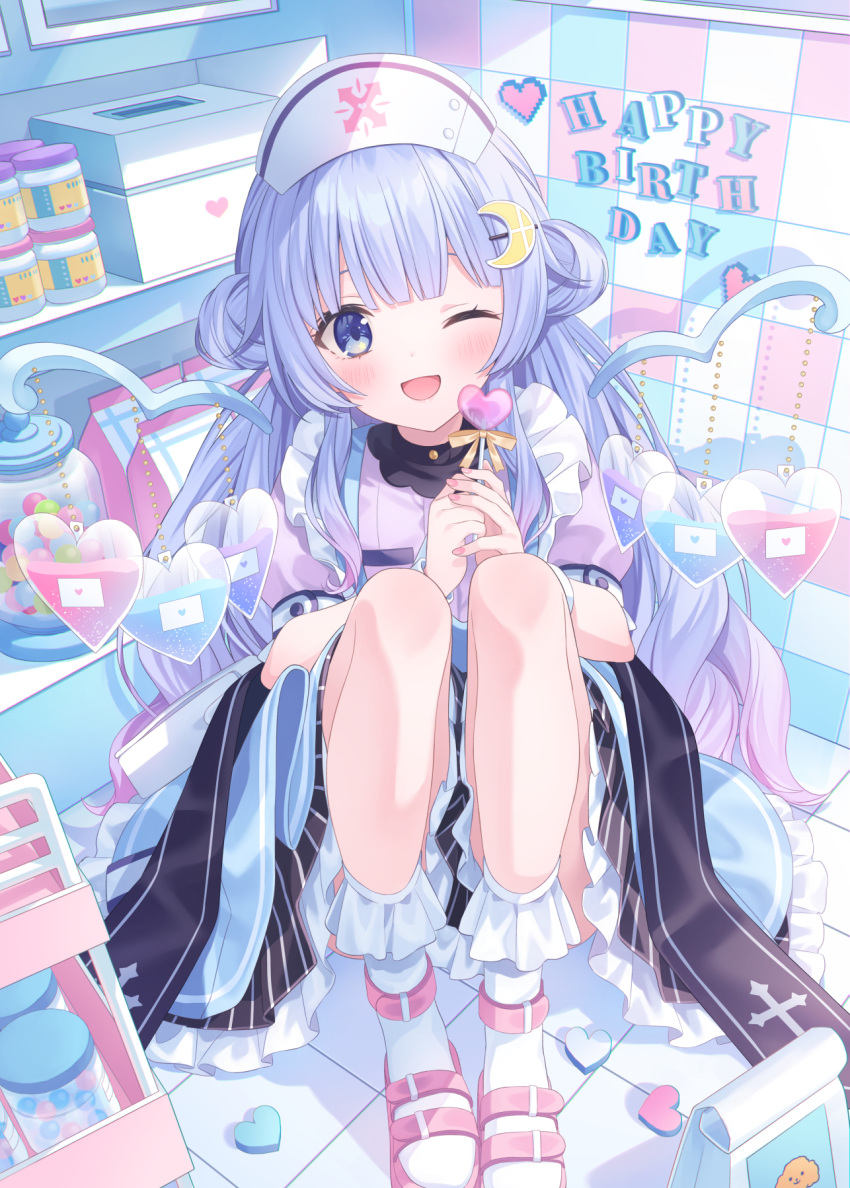 blue_eyes blue_hair blush box candy crescent crescent_hair_ornament female food hair_ornament happy_birthday hat highres jimmy_madomagi long_hair looking_at_viewer medicine mirutani_nia noripro nurse nurse_cap one_eye_closed open_mouth pill sandals shelf sitting solo virtual_youtuber