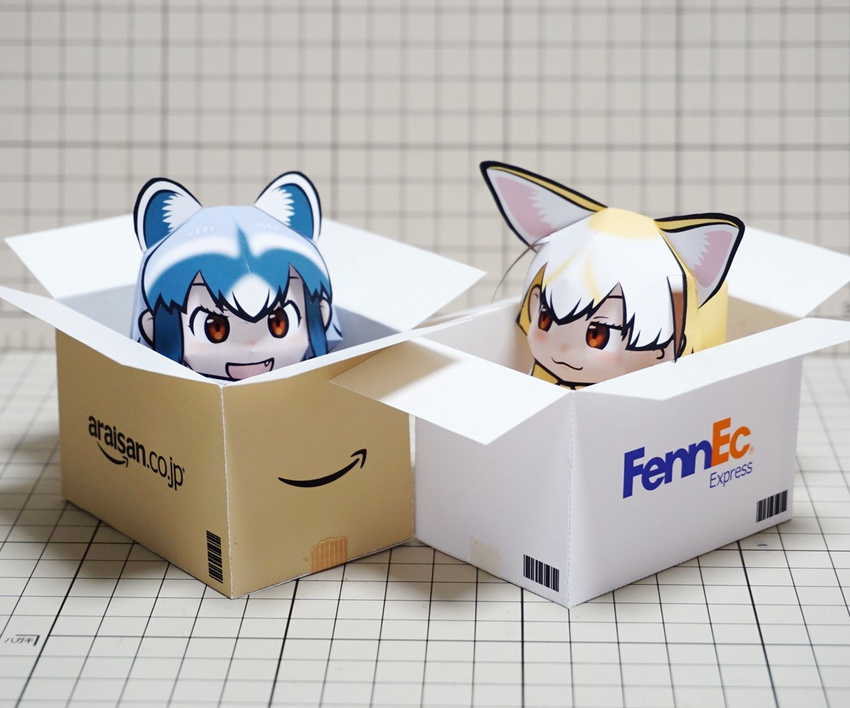 2girls amazon_(company) animal_ears blonde_hair bow bowtie box brand_name_imitation cardboard_box commentary common_raccoon_(kemono_friends) fedex fennec_(kemono_friends) fox_ears in_box in_container kemono_friends multicolored_hair multiple_girls muumin_(muumin_craft) oerba_yun_fang open_mouth papercraft_(medium) parody photo_(medium) raccoon_ears short_hair smile unconventional_media