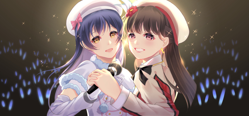 2girls beret blue_hair blush brown_hair capelet detached_sleeves fur_trim hat highres holding holding_hands holding_microphone interlocked_fingers long_hair long_sleeves looking_at_viewer love_live! love_live!_school_idol_project microphone mimori_suzuko multiple_girls real_life_insert smile snow_halation sonoda_umi sore_wa_bokutachi_no_kiseki unnik voice_actor