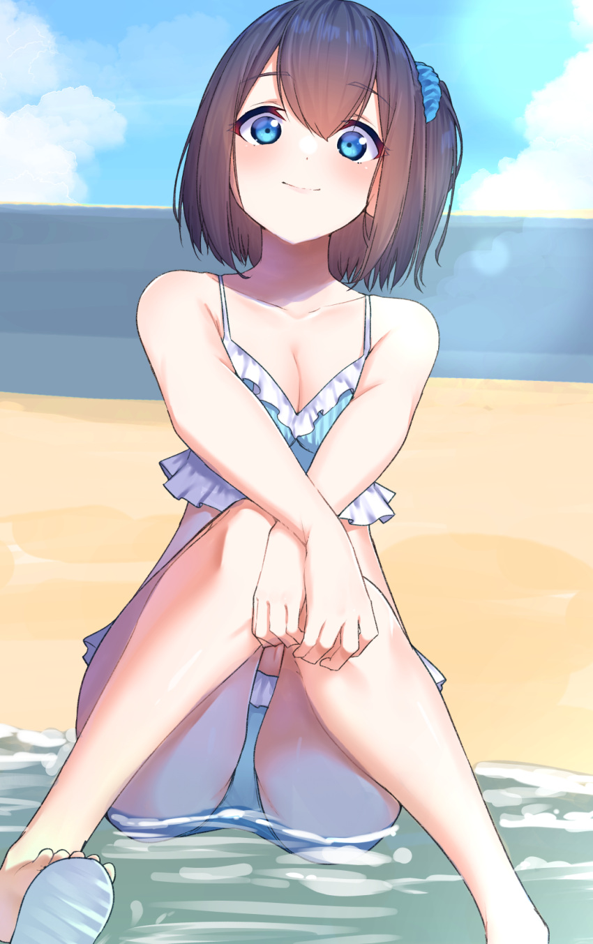 bare_arms bare_legs bare_shoulders beach bikini black_hair blue_bikini blue_eyes blue_scrunchie blue_sky breasts cleavage closed_mouth cloud commentary day female frilled_bikini frills hair_between_eyes hair_ornament hair_scrunchie highres knees_together_feet_apart knees_up looking_at_viewer medium_breasts one_side_up original outdoors sand scrunchie sky smile solo suzunari_shizuku swimsuit water yuki_arare