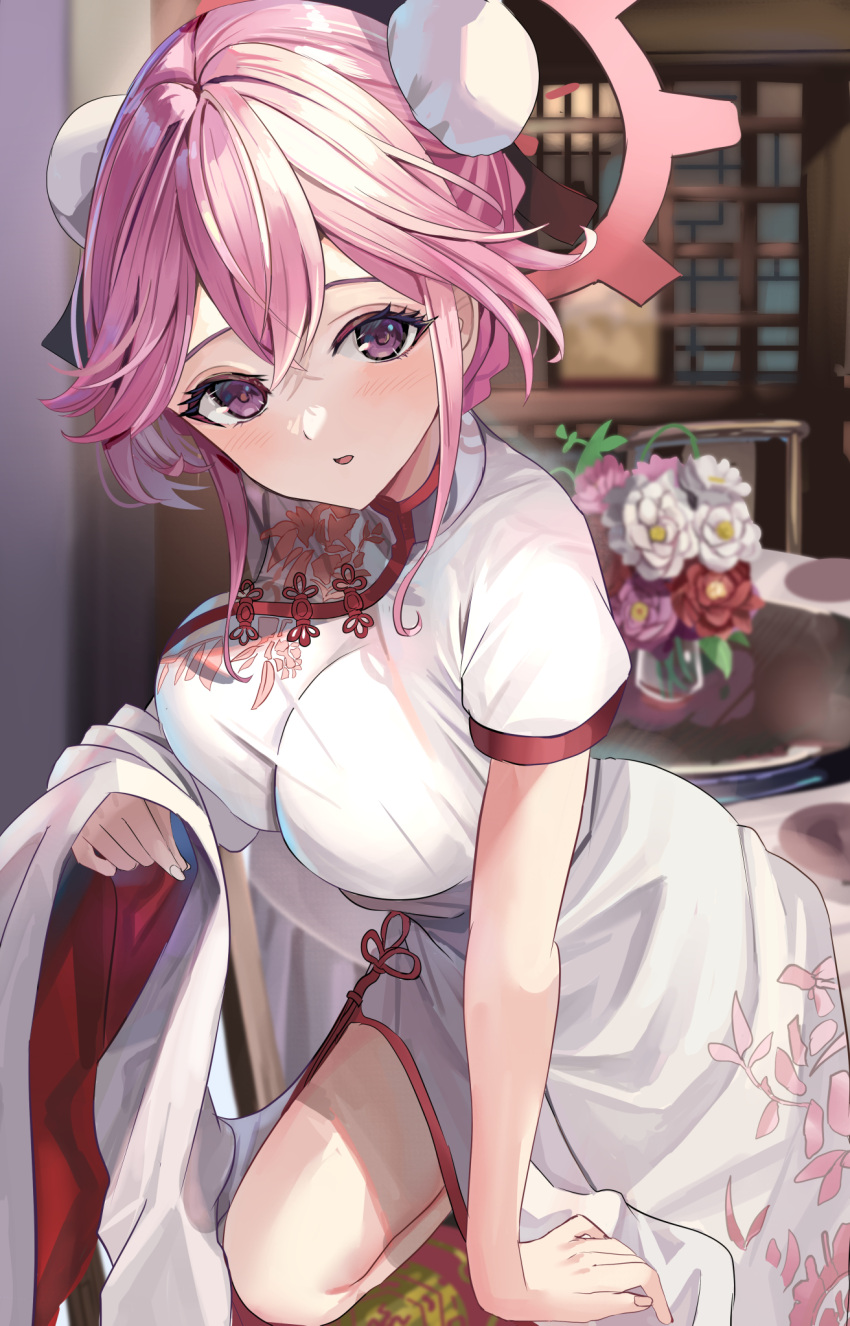 arm_support blue_archive blurry blurry_background blush breasts bun_cover china_dress chinese_clothes commentary double_bun dress female floral_print_dress flower hair_between_eyes hair_bun halo highres huge_breasts long_hair looking_at_viewer official_alternate_costume on_one_knee open_mouth pink_eyes pink_flower pink_hair pink_halo purple_flower red_flower short_sleeves solo suidou_chaahan table tomoe_(blue_archive) tomoe_(qipao)_(blue_archive) white_dress white_flower window