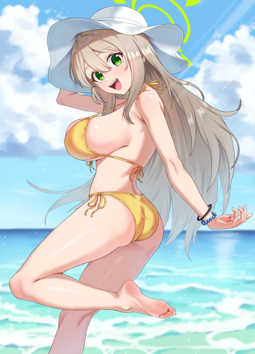 :d ass bare_arms bare_legs bare_shoulders barefoot beach bikini blue_archive blush breasts commentary day feet female front-tie_top green_eyes halo halterneck hat highres kadokadokado large_breasts light_brown_hair long_hair looking_at_viewer nonomi_(blue_archive) nonomi_(swimsuit)_(blue_archive) ocean official_alternate_costume open_mouth outdoors side-tie_bikini_bottom sideboob sky smile soles solo strap_gap string_bikini sun_hat swimsuit thighs toes very_long_hair water white_hat yellow_bikini