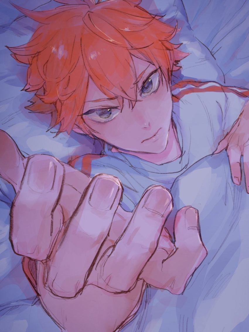 1boy 830_(hamio) bed bed_sheet brown_eyes haikyuu!! hair_between_eyes highres hinata_shouyou looking_at_viewer lying male_focus messy_hair on_back orange_hair pillow reaching reaching_towards_viewer shirt solo white_shirt