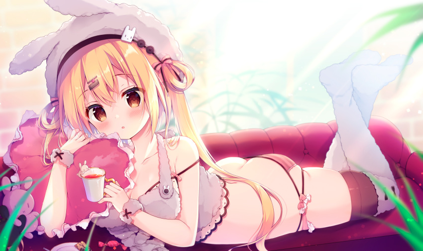 animal_hat ass bare_arms bare_shoulders blonde_hair brown_eyes candy cup feet female food hair_ornament hairclip hat heart heart-shaped_pillow highres holding holding_cup indoors izumiyuhina long_hair looking_at_viewer lying no_shoes on_stomach original panties photoshop_(medium) pillow rabbit_hat solo strap_slip striped_clothes striped_panties the_pose thighhighs two_side_up underwear white_hat white_thighhighs wrist_cuffs