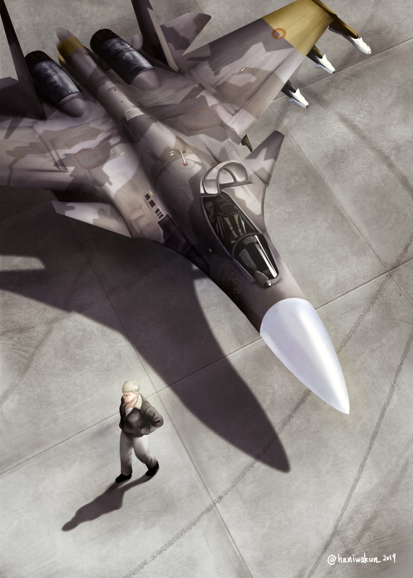 1boy ace_combat ace_combat_04 aircraft airplane bad_perspective blonde_hair canopy_(aircraft) cockpit emblem erusean_flag fighter_jet from_above hands_in_pockets haniwakun_2019 highres jacket jet military military_vehicle missile pants pilot shadow su-37 twitter_username vehicle_focus walking yellow_13