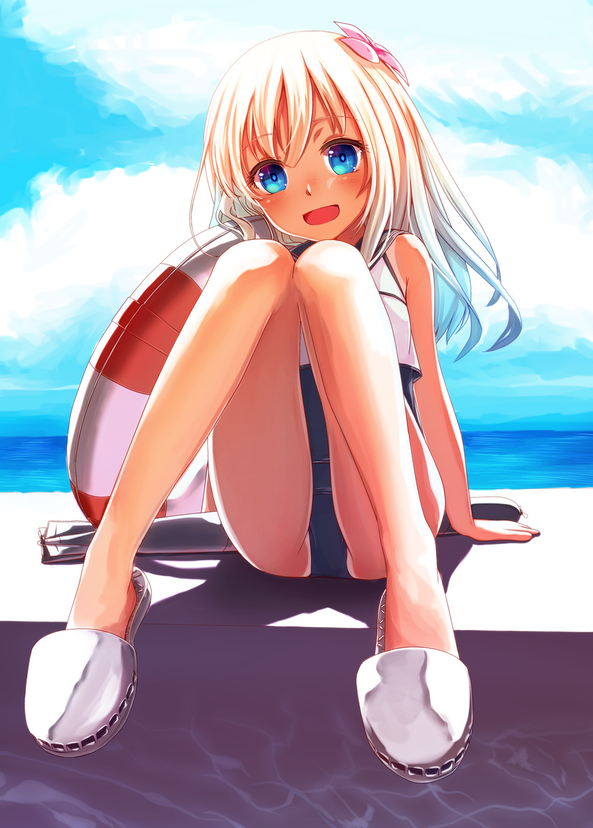 :d absurdres blonde_hair blue_eyes blush commentary_request crop_top female flower hair_flower hair_ornament highres innertube kantai_collection legs long_hair looking_at_viewer mocha_(snowflake) open_mouth photoshop_(medium) ro-500_(kancolle) school_swimsuit sitting smile solo swim_ring swimsuit swimsuit_under_clothes tan tanlines