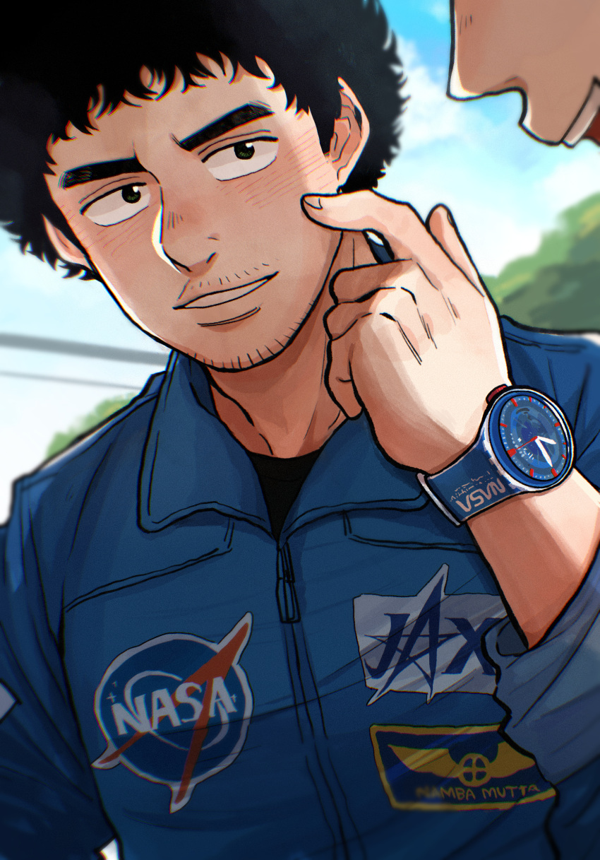 1boy afro black_hair blue_shirt character_name day facial_hair hand_up highres jaxa keroko_(keroooon) male_focus nanba_mutta nasa_logo outdoors shirt solo_focus stubble uchuu_kyoudai uniform upper_body watch