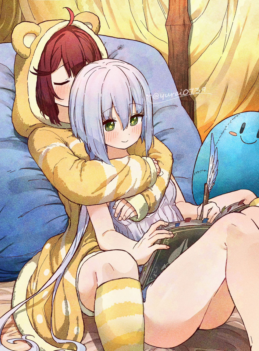 2girls animal_hood atelier_(series) atelier_sophie book closed_eyes commentary highres hood hoodie hug multiple_girls plachta puni_(atelier) red_hair sitting sophie_neuenmuller white_hair writing yellow_hoodie yurai0739