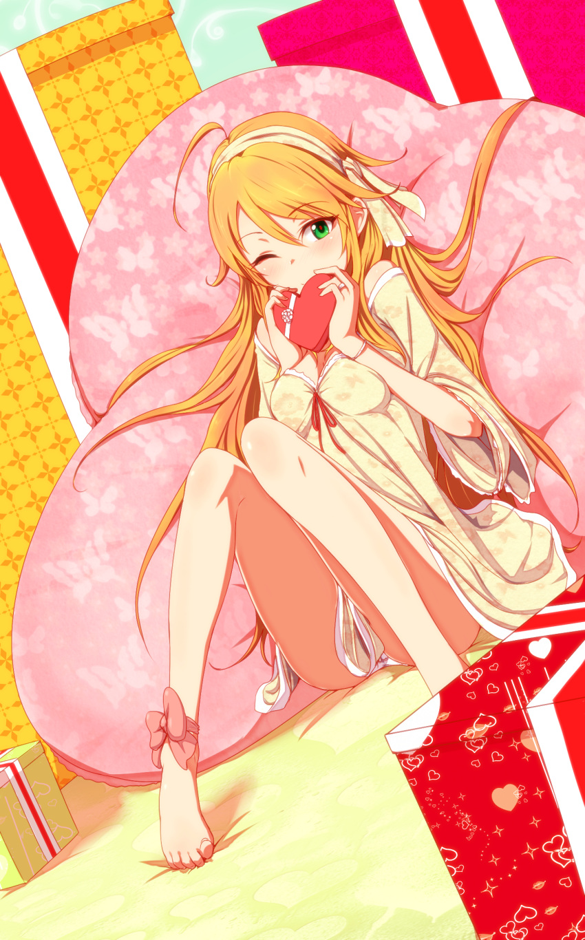 ahoge ankle_ribbon bad_id bad_pixiv_id bare_legs barefoot blonde_hair chocolate commentary_request dress feet female gift green_eyes hairband heart highres hoshii_miki idolmaster idolmaster_(classic) leg_ribbon legs long_hair looking_at_viewer one_eye_closed pillow ribbon shirihime smile solo toe-point valentine