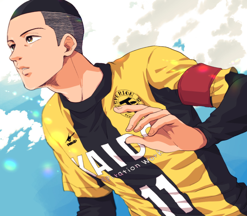 1boy ao_ashi armband black_hair brown_eyes buzz_cut cloud day ika_choco long_sleeves looking_to_the_side male_focus outdoors short_hair soccer_uniform solo sportswear upper_body very_short_hair yoshitsune_kenta