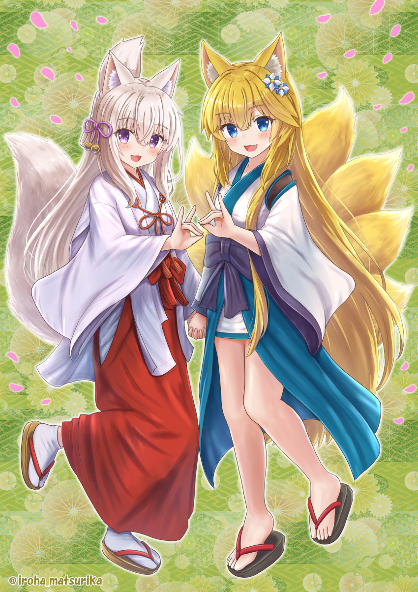 2girls :d absurdres animal_ear_fluff animal_ears black_bow black_footwear blonde_hair blue_eyes blush bow brown_footwear collaboration commentary_request flower folded_ponytail fox_ears fox_girl fox_shadow_puppet fox_tail green_background grey_hair hair_between_eyes hair_flower hair_ornament hakama hakama_skirt highres holding_hands interlocked_fingers iroha_(iroha_matsurika) japanese_clothes kimono kitsune koyoi_(iroha_(iroha_matsurika)) long_sleeves looking_at_viewer miko multiple_girls original petals purple_eyes red_bow red_hakama sandals skirt smile socks standing standing_on_one_leg tabi tail white_flower white_kimono white_legwear wide_sleeves zouri