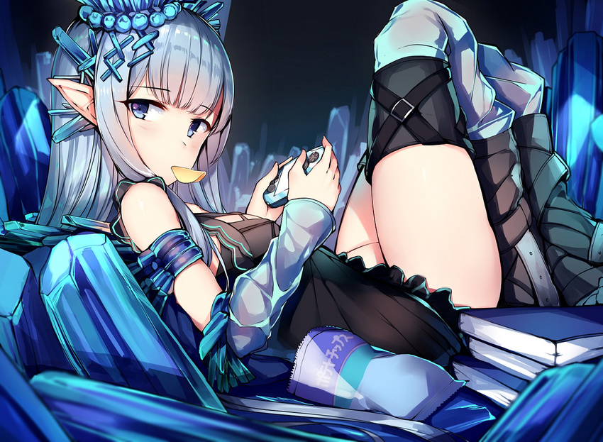 bare_shoulders black_dress blue_eyes blunt_bangs chips_(food) commentary_request crystal detached_sleeves dress erin_(granblue_fantasy) eyebrows female food food_in_mouth from_side granblue_fantasy hair_ornament handheld_game_console knees_up long_hair looking_at_viewer looking_to_the_side lying mouth_hold on_back orihi_chihiro playing_games pointy_ears potato_chips short_dress solo x_hair_ornament