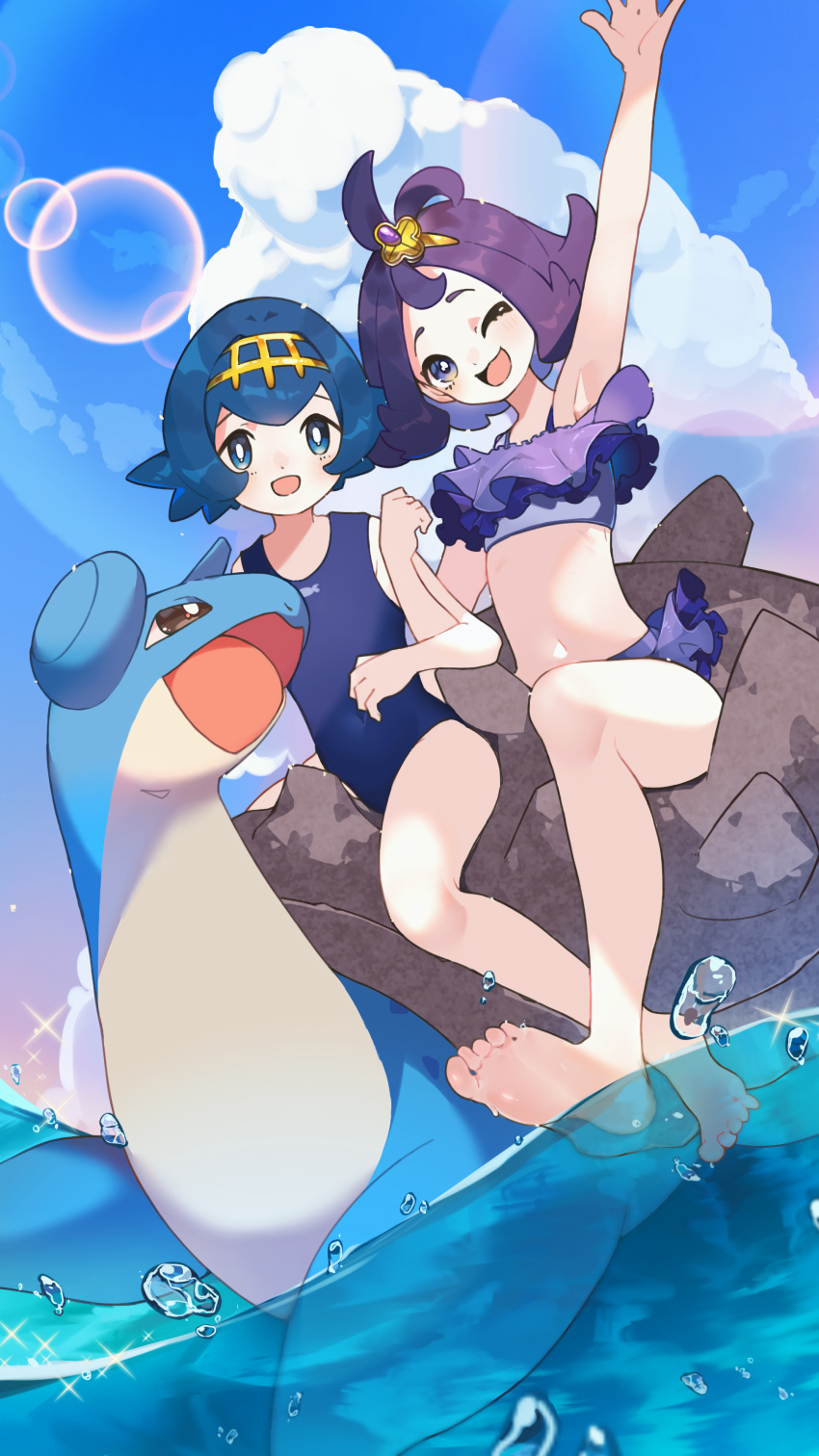 2girls :d ;d absurdres acerola_(pokemon) arm_up barefoot blue_hair bright_pupils chi_ero_(61193180) cloud commentary_request day hair_ornament hairband hairclip highres knees lana_(pokemon) locked_arms multiple_girls navel one-piece_swimsuit one_eye_closed open_mouth outdoors partially_underwater_shot pokemon pokemon_sm purple_hair riding riding_pokemon sitting sky smile swimsuit toes topknot water white_pupils yellow_hairband