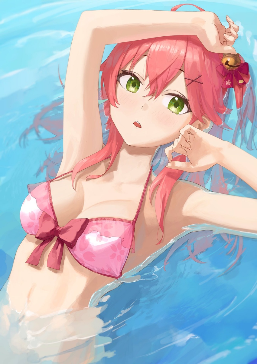 ahoge arm_up asymmetrical_hair bell bikini blush breasts cleavage commentary female green_eyes hair_bell hair_between_eyes hair_ornament halterneck highres hololive long_hair looking_at_viewer makimaki_makky7 medium_breasts navel official_alternate_costume one_side_up open_mouth partially_submerged pink_bikini pink_hair sakura_miko sakura_miko_(hololive_summer_2019) sidelocks solo stomach swimsuit upper_body virtual_youtuber water x_hair_ornament