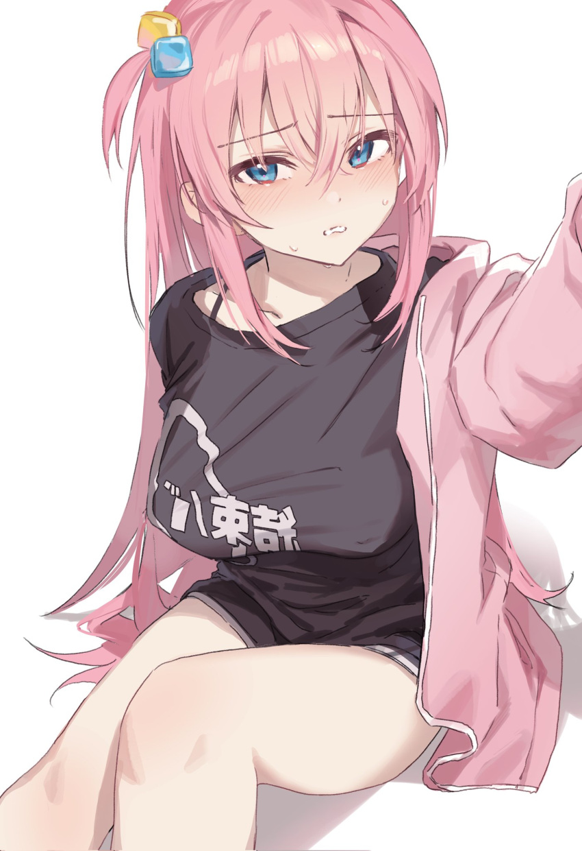 black_shirt black_shorts blue_eyes blush bocchi_the_rock! breasts commentary cube_hair_ornament female gotoh_hitori hair_between_eyes hair_ornament highres hyuji_0w0 jacket kessoku_band_t-shirt large_breasts long_hair long_sleeves looking_at_viewer one_side_up open_clothes open_jacket pink_hair pink_jacket shirt shorts simple_background sitting solo sweat track_jacket white_background