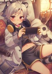  1boy animal_ears bed book bottle eating headphones lolicon looking_at_viewer male_focus midriff_peek navel nintendo_switch original playing_games red_eyes shorts solo utsunomiya_hetaru water_bottle white_hair 