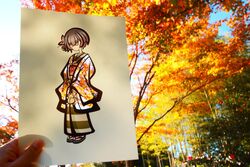  artist&#039;s_hand_in_frame autumn autumn_leaves blue_hair closed_eyes dark_blue_hair doll female full_body geta holding holding_doll idolmaster idolmaster_shiny_colors japanese_clothes kimono kirigami kirigami_(medium) kotetsu_of light_smile morino_rinze obi papercraft_(medium) photo_(medium) sash simple_background solo unconventional_media white_background 