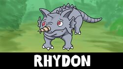  16:9 ambiguous_gender body_spikes ergomancy generation_1_pokemon grey_body hi_res horn nintendo pokemon pokemon_(species) red_eyes rhydon smile solo widescreen yee 