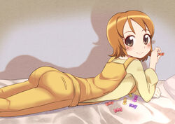  blush brown_eyes brown_hair commentary_request female happinesscharge_precure! lying niizuka_(c-drop) on_stomach oomori_yuuko overalls precure short_hair smile solo yellow_overalls 