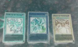 5:3 ambiguous_gender attack_stat_(yu-gi-oh) card card_template defense_stat_(yu-gi-oh) deity dragon duel_monster egyptian group inverted_colors konami low_res monster_card_(yu-gi-oh) mythological_creature mythological_scalie mythology not_furry obelisk_the_tormentor scalie slifer_the_sky_dragon the_winged_dragon_of_ra trading_card trading_card_game trading_card_template unknown_artist yu-gi-oh! yu-gi-oh_card