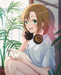  absurdres adjusting_headphones bare_arms bare_legs binder_clip blurry blurry_foreground blush brown_hair commentary cowboy_shot curtains emu_(emum) female green_eyes headphones highres holding holding_paper idolmaster idolmaster_cinderella_girls indoors looking_at_viewer open_mouth paper plant potted_plant shadow shirt short_hair short_sleeves smile solo squatting t-shirt tada_riina white_shirt 